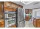 Kitchen with stainless steel appliances and dark wood cabinets at 2267 Heron Cir, Clearwater, FL 33762