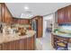 Open concept kitchen with island, granite counters, and stainless steel appliances at 2267 Heron Cir, Clearwater, FL 33762