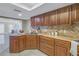 Modern kitchen with granite countertops, dark wood cabinets, and an island at 2267 Heron Cir, Clearwater, FL 33762