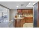 Well-equipped kitchen featuring granite countertops and dark wood cabinetry at 2267 Heron Cir, Clearwater, FL 33762