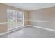 Bright living room featuring tile floors and large window at 2267 Heron Cir, Clearwater, FL 33762