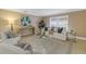 Cozy living room with comfortable seating and large window at 2267 Heron Cir, Clearwater, FL 33762