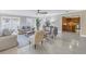 Open living room featuring a kitchen view and tile floors at 2267 Heron Cir, Clearwater, FL 33762