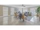 Living room with tile floors, comfy seating, and large windows at 2267 Heron Cir, Clearwater, FL 33762