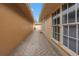 Brick-paved side yard walkway with a view of the backyard at 2267 Heron Cir, Clearwater, FL 33762