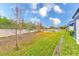 Landscaped backyard with a pond view, providing a serene outdoor space at 2441 Foggy Creek Cir, Clearwater, FL 33764