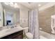 Clean bathroom with tub shower combo and updated vanity at 2441 Foggy Creek Cir, Clearwater, FL 33764