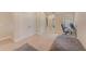 Upstairs bedroom with carpeted floor, a workspace, and built-in closet at 2441 Foggy Creek Cir, Clearwater, FL 33764