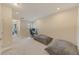 Upstairs bedroom with carpeted floor and a view of a hallway at 2441 Foggy Creek Cir, Clearwater, FL 33764
