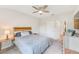 Comfortable bedroom with a queen-size bed and built in shelving at 2441 Foggy Creek Cir, Clearwater, FL 33764