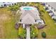 Aerial view of community pool with lounge chairs and surrounding landscape at 2441 Foggy Creek Cir, Clearwater, FL 33764
