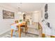 Dining room with a wooden table, kitchen view, and neutral color palette at 2441 Foggy Creek Cir, Clearwater, FL 33764