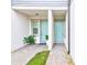 Front entry with double doors and brick walkway at 2441 Foggy Creek Cir, Clearwater, FL 33764