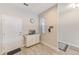 Kitchen entryway with white cabinets and a clock at 2441 Foggy Creek Cir, Clearwater, FL 33764