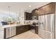 Modern kitchen with stainless steel appliances and white cabinetry at 2441 Foggy Creek Cir, Clearwater, FL 33764