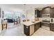 Open concept kitchen with island and stainless steel appliances at 2441 Foggy Creek Cir, Clearwater, FL 33764