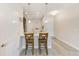 Modern kitchen with breakfast bar and stainless steel appliances at 2441 Foggy Creek Cir, Clearwater, FL 33764