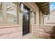 Black front door with stonework and modern light fixtures at 262 4Th N Ave, St Petersburg, FL 33701