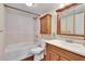 Bathroom with shower/tub combo and wood vanity at 3022 Short Leaf St, Wesley Chapel, FL 33543