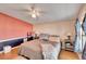 Primary bedroom with king bed,accent wall and ceiling fan at 3022 Short Leaf St, Wesley Chapel, FL 33543
