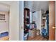 Spacious walk-in closet with shelving and hanging rods at 3022 Short Leaf St, Wesley Chapel, FL 33543