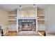 Stone fireplace with built-in shelving at 3022 Short Leaf St, Wesley Chapel, FL 33543