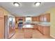 Modern kitchen with stainless steel appliances and granite countertops at 3022 Short Leaf St, Wesley Chapel, FL 33543