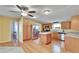 Bright kitchen with island, stainless steel appliances, and wood cabinets at 3022 Short Leaf St, Wesley Chapel, FL 33543