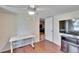 Home office with a standing desk and hardwood floors at 3022 Short Leaf St, Wesley Chapel, FL 33543