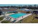 Community pool with lounge chairs and playground at 3022 Short Leaf St, Wesley Chapel, FL 33543