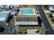 Community pool with surrounding patio and building at 3022 Short Leaf St, Wesley Chapel, FL 33543