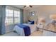Cozy bedroom with a full-size bed and water views at 32722 Osprey Peak Way, San Antonio, FL 33576