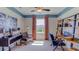 Home office with built-in shelving and seating area at 32722 Osprey Peak Way, San Antonio, FL 33576