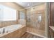Spa-like bathroom featuring a walk-in shower and a separate tub at 3409 77Th E Ct, Palmetto, FL 34221