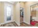 Elegant entryway with stained glass door and access to bathroom at 3409 77Th E Ct, Palmetto, FL 34221