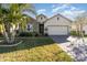 Spacious house with stone exterior and palm trees at 3409 77Th E Ct, Palmetto, FL 34221