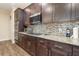 Kitchen with granite countertops and dark brown cabinets at 3409 77Th E Ct, Palmetto, FL 34221