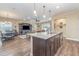 Open concept kitchen with island and views to living room at 3409 77Th E Ct, Palmetto, FL 34221