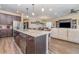 Open concept kitchen with island and stainless steel appliances at 3409 77Th E Ct, Palmetto, FL 34221