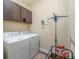 Laundry room with washer, dryer, and storage cabinets at 3409 77Th E Ct, Palmetto, FL 34221
