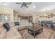 Open living space with large sectional sofa and adjacent dining area at 3409 77Th E Ct, Palmetto, FL 34221