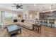 Open concept living area with sectional sofa and kitchen view at 3409 77Th E Ct, Palmetto, FL 34221