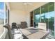 Enjoy the outdoors in this screened patio with seating and a table at 3409 77Th E Ct, Palmetto, FL 34221