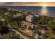 Beachfront property at sunset, with a charming house at 3478 Gum Dr, Weeki Wachee, FL 34607