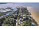 Wide aerial view of property and neighborhood near the water at 3478 Gum Dr, Weeki Wachee, FL 34607