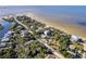 Aerial view of waterfront community, showcasing beach and houses at 3478 Gum Dr, Weeki Wachee, FL 34607