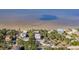 Aerial view showcasing waterfront property with a house and surrounding homes at 3478 Gum Dr, Weeki Wachee, FL 34607