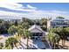 Aerial view of a house with palm trees and a waterfront view at 3478 Gum Dr, Weeki Wachee, FL 34607