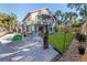 Relaxing backyard with hammock, lawn, and tropical plants at 3478 Gum Dr, Weeki Wachee, FL 34607