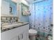 Clean bathroom with granite countertop and starfish shower curtain at 3478 Gum Dr, Weeki Wachee, FL 34607